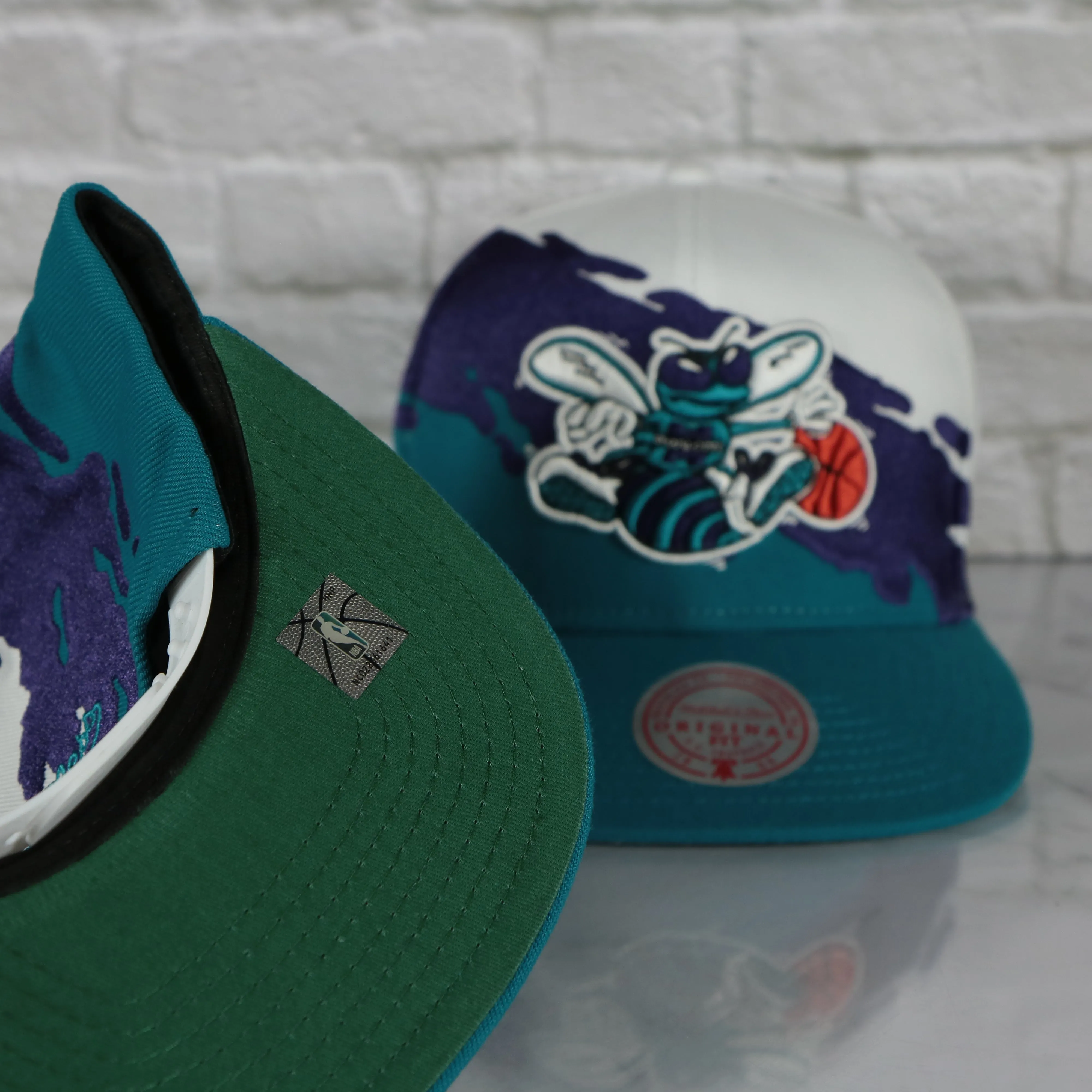 Charlotte Hornets Throwback Paintbrush Mitchell and Ness Snapback | Purple/White/Teal